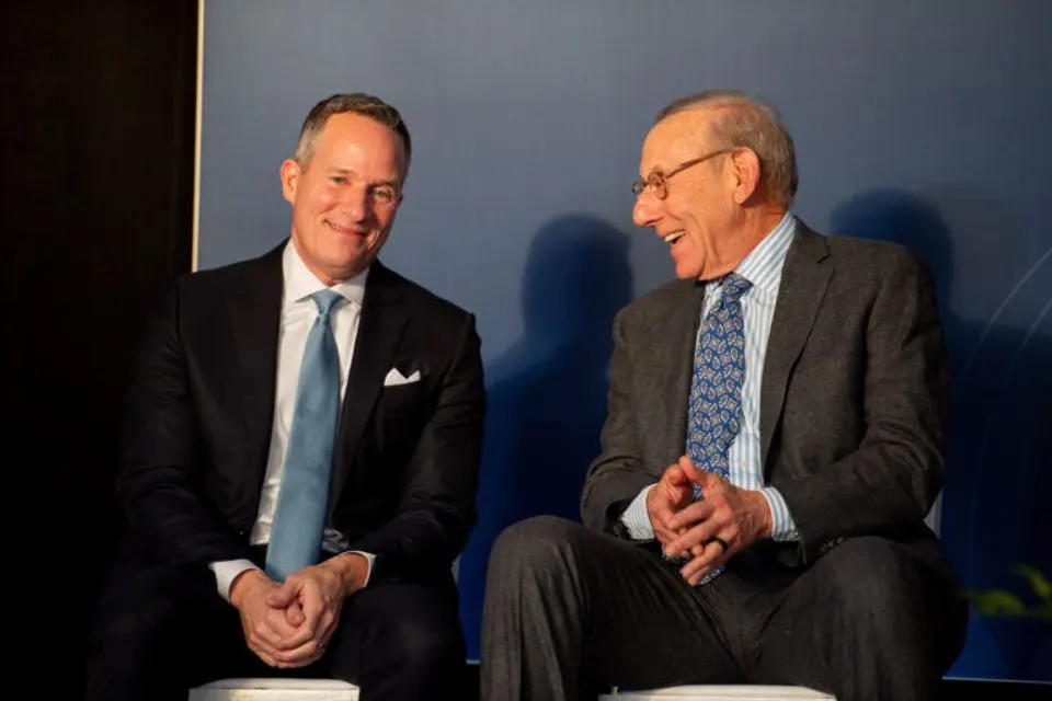 Christopher Ilitch and Stephen Ross chat at the groundbreaking for the UMCI
