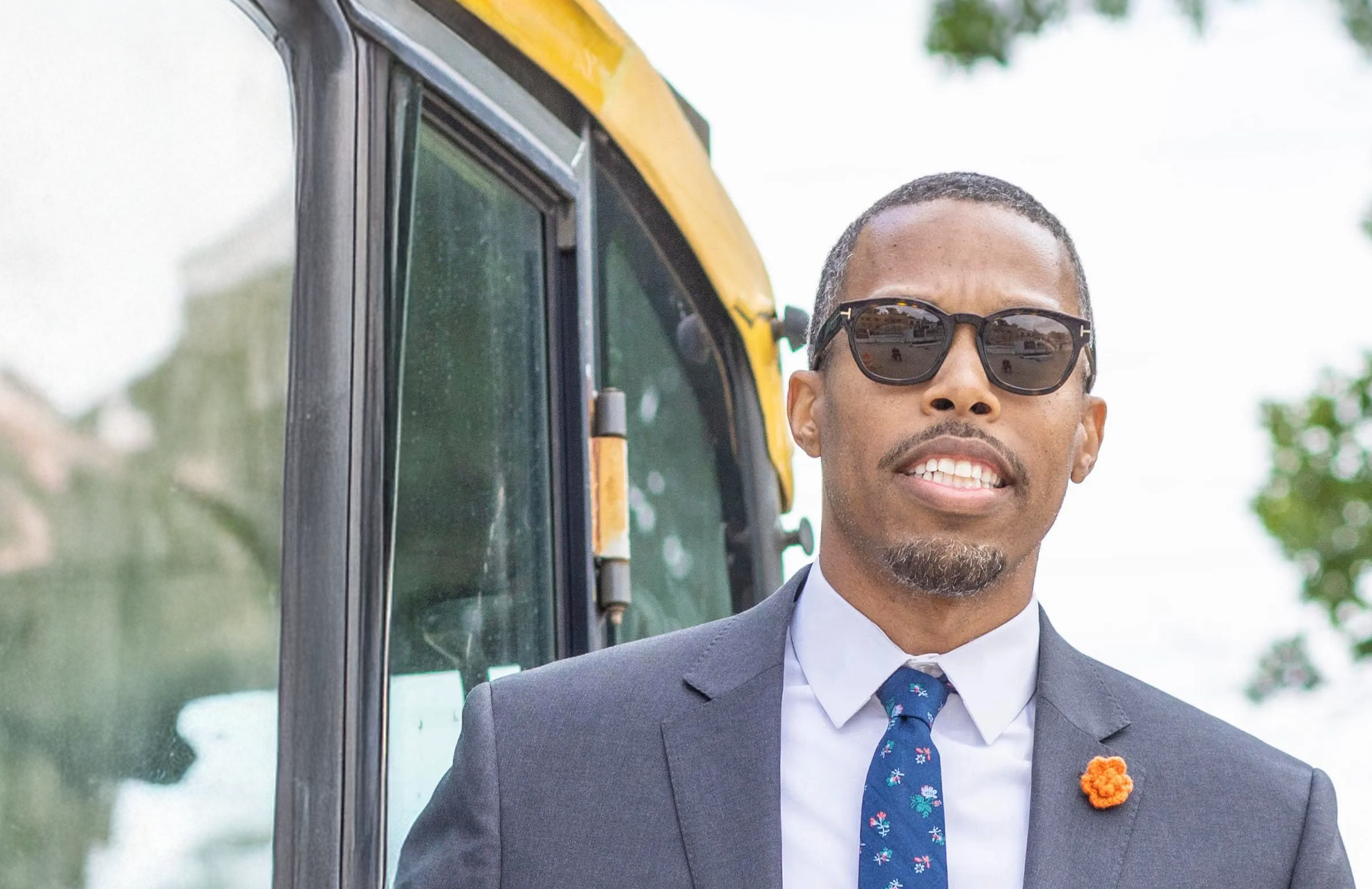 Edward Carrington, Founder of Flux City, in a suit and tie outdoors