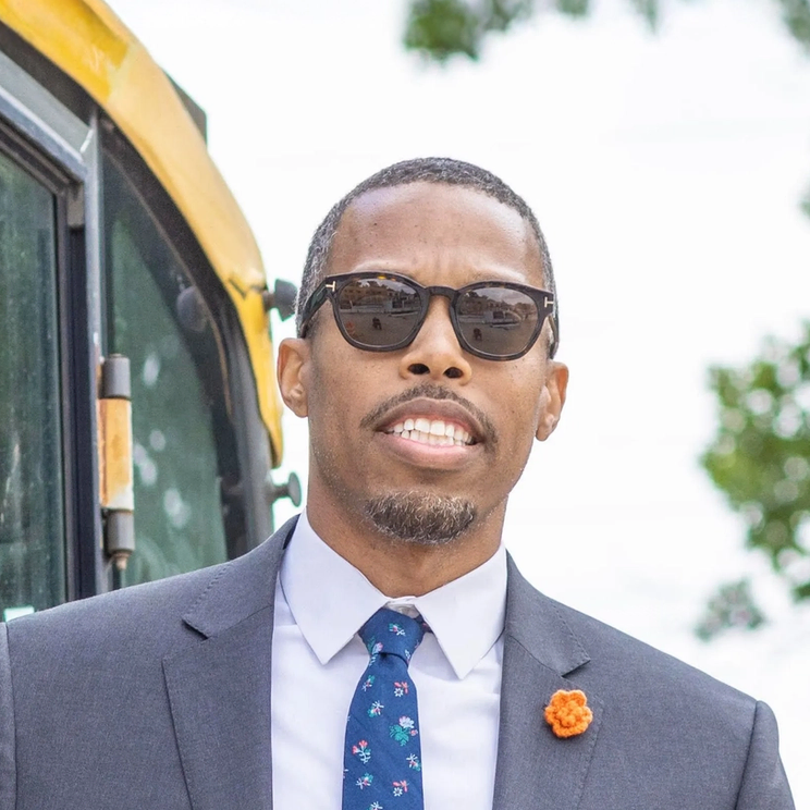 Edward Carrington, Founder of Flux City, in a suit and tie outdoors