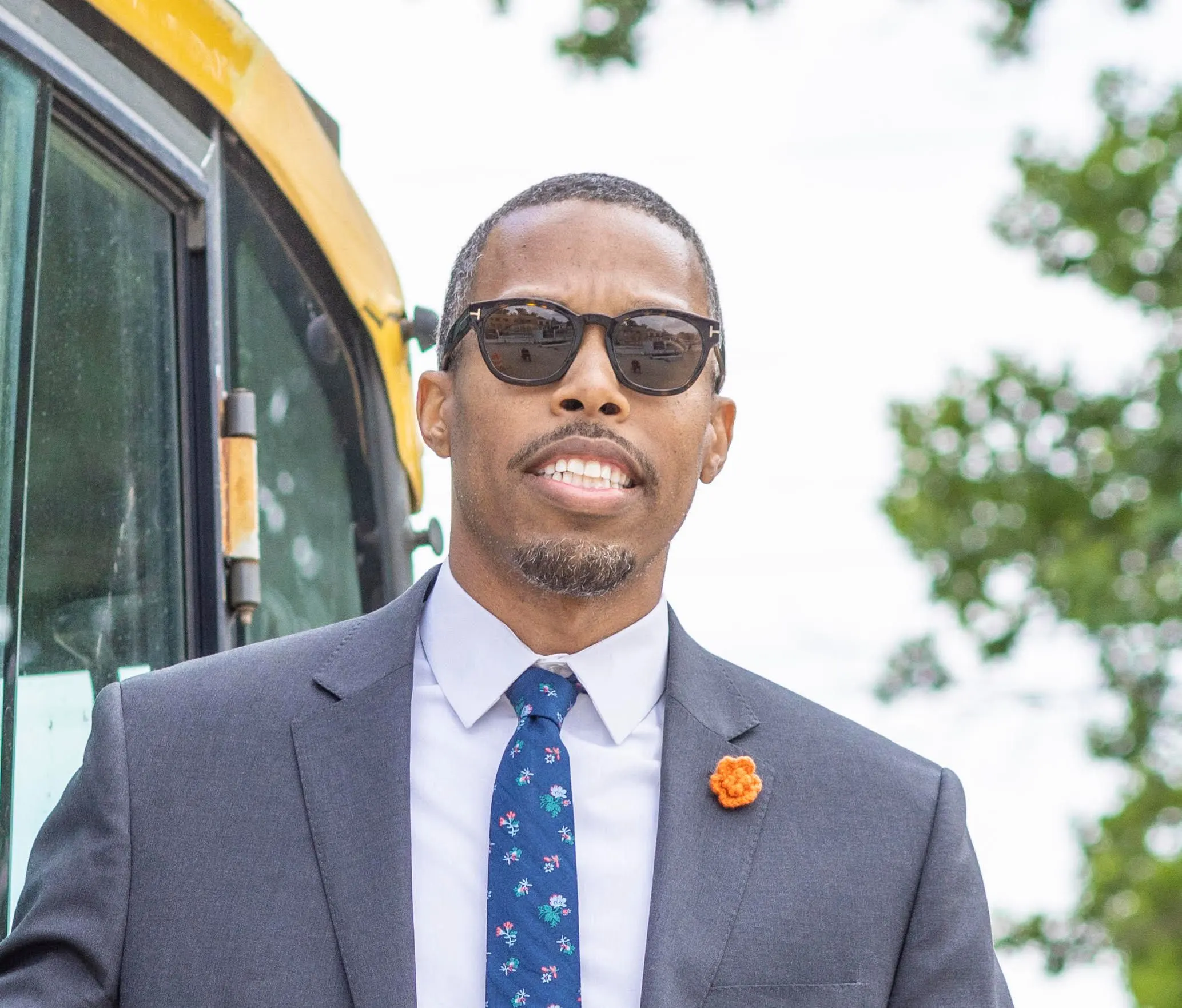 Edward Carrington, Founder of Flux City, in a suit and tie outdoors