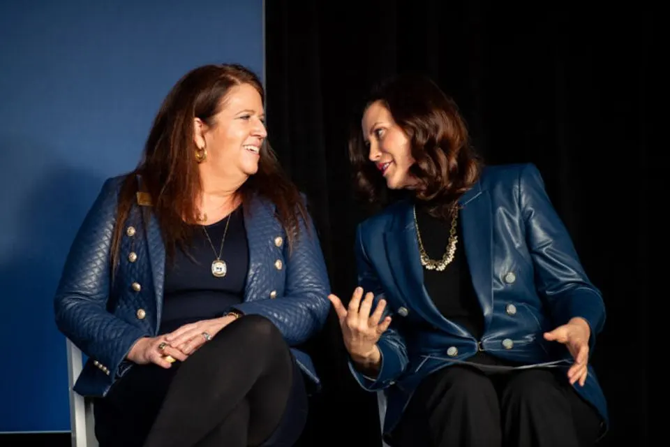 Gretchen Whitmer talking to U-M Regent Sarah Hubbard